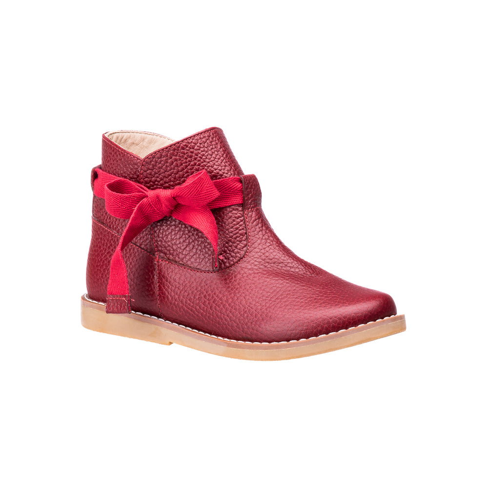 Red leather toddler bootie with side bow and beige sole.