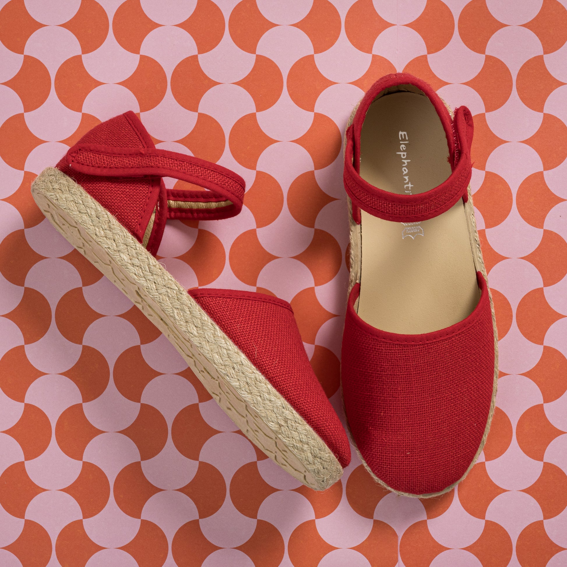 Red linen espadrille with adjustable ankle strap and woven jute sole for toddlers and kids.
