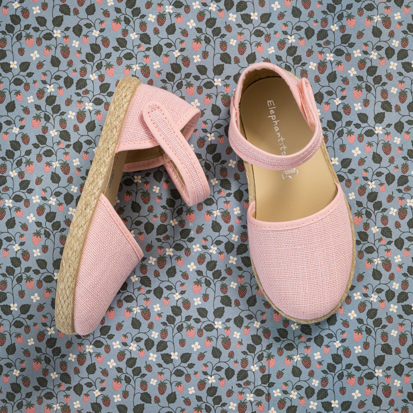 Pink linen espadrille with ankle strap and natural jute sole for toddlers and kids.