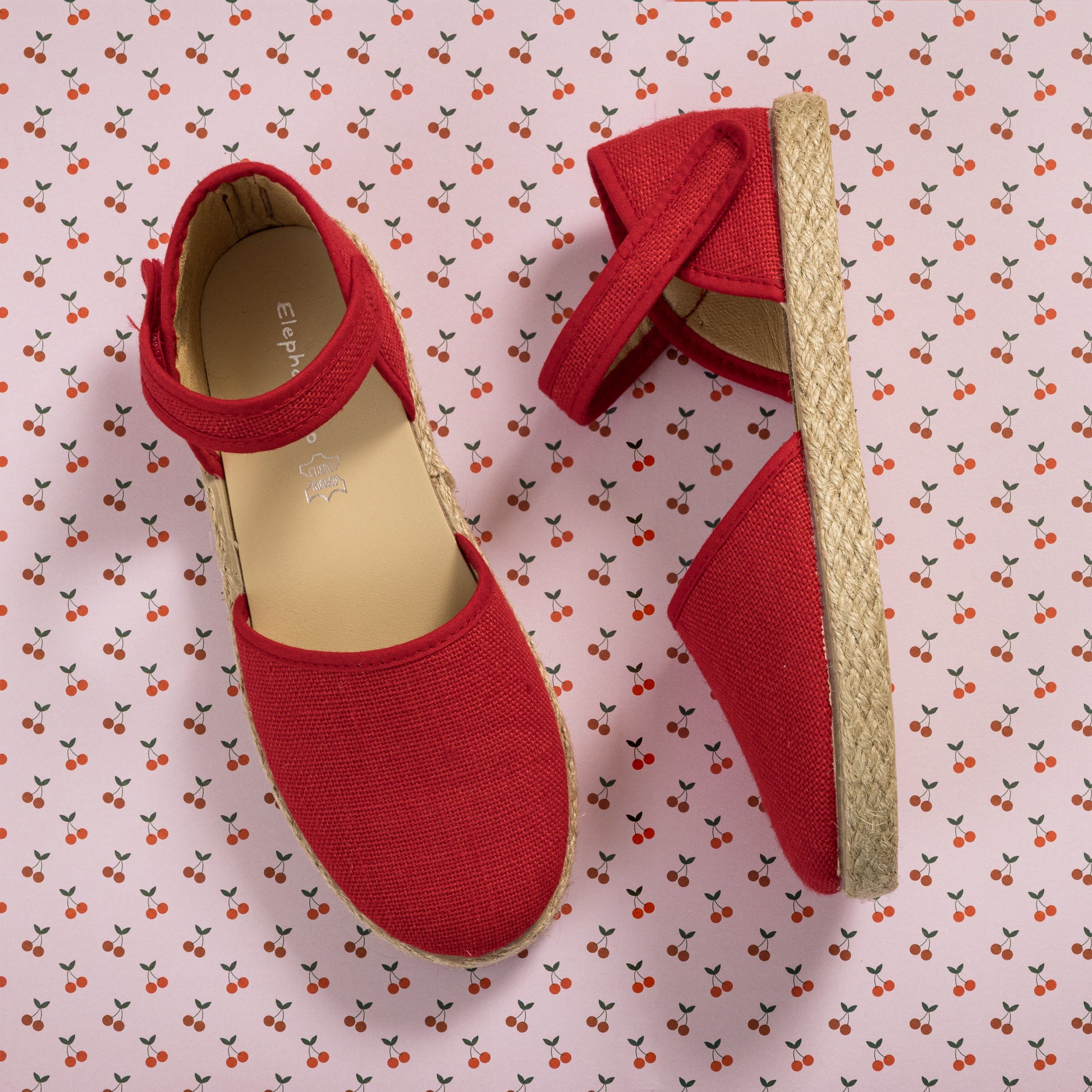 Red linen espadrille with ankle strap and jute-wrapped sole for toddlers and kids.