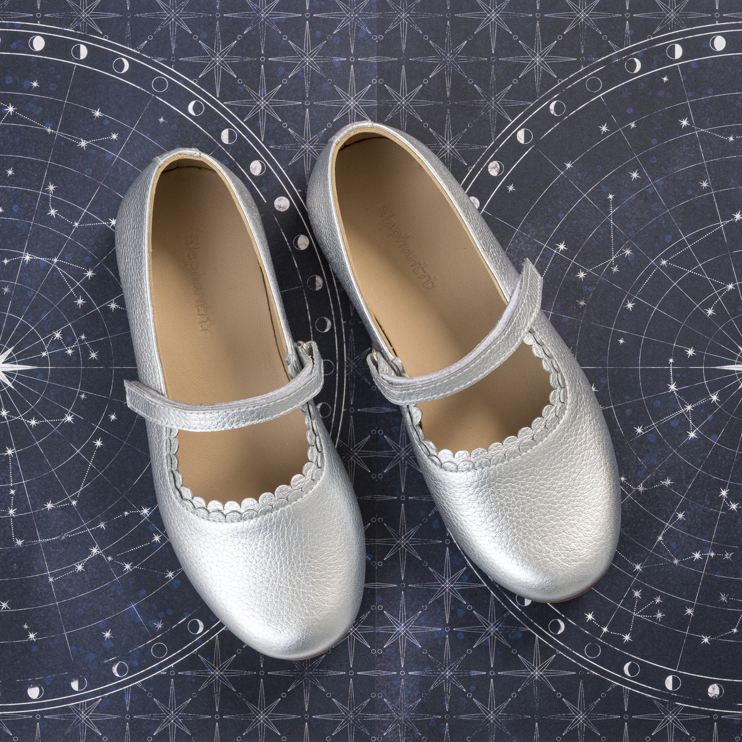 Silver toddler girls' Mary Jane flats with scalloped edges and hook-and-loop strap closure.