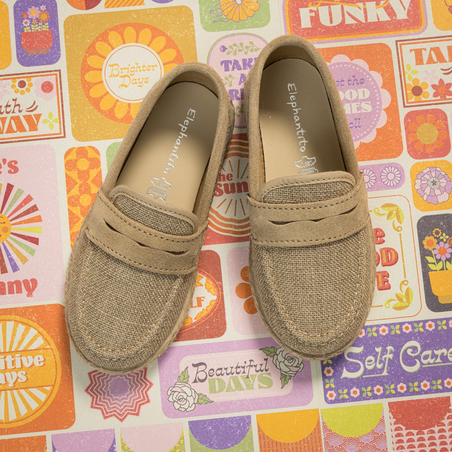 Beige toddler loafer espadrilles with stitched detailing and soft fabric upper.