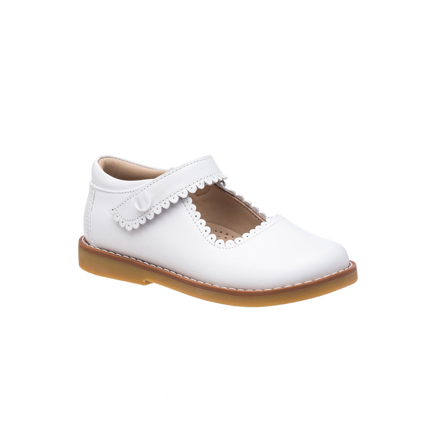 White leather Mary Jane shoe for girls with scalloped edges and tan sole.