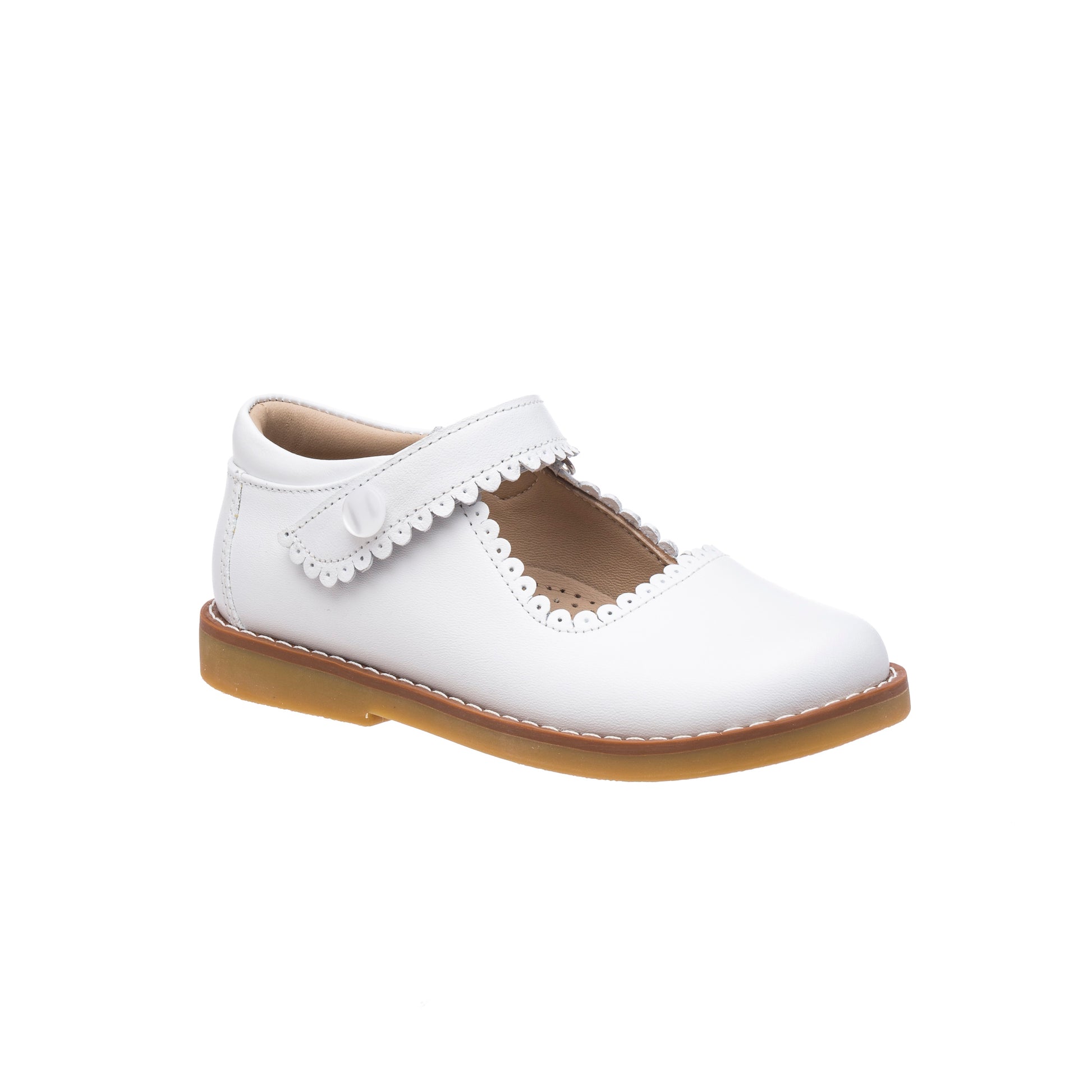 White leather Mary Jane shoe for girls with scalloped edges and tan sole.
