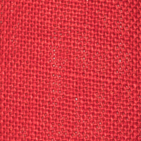 Close-up of red linen fabric with textured weave on children's espadrille shoe.