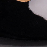 Black patent leather ballet flat with rounded toe and smooth finish.