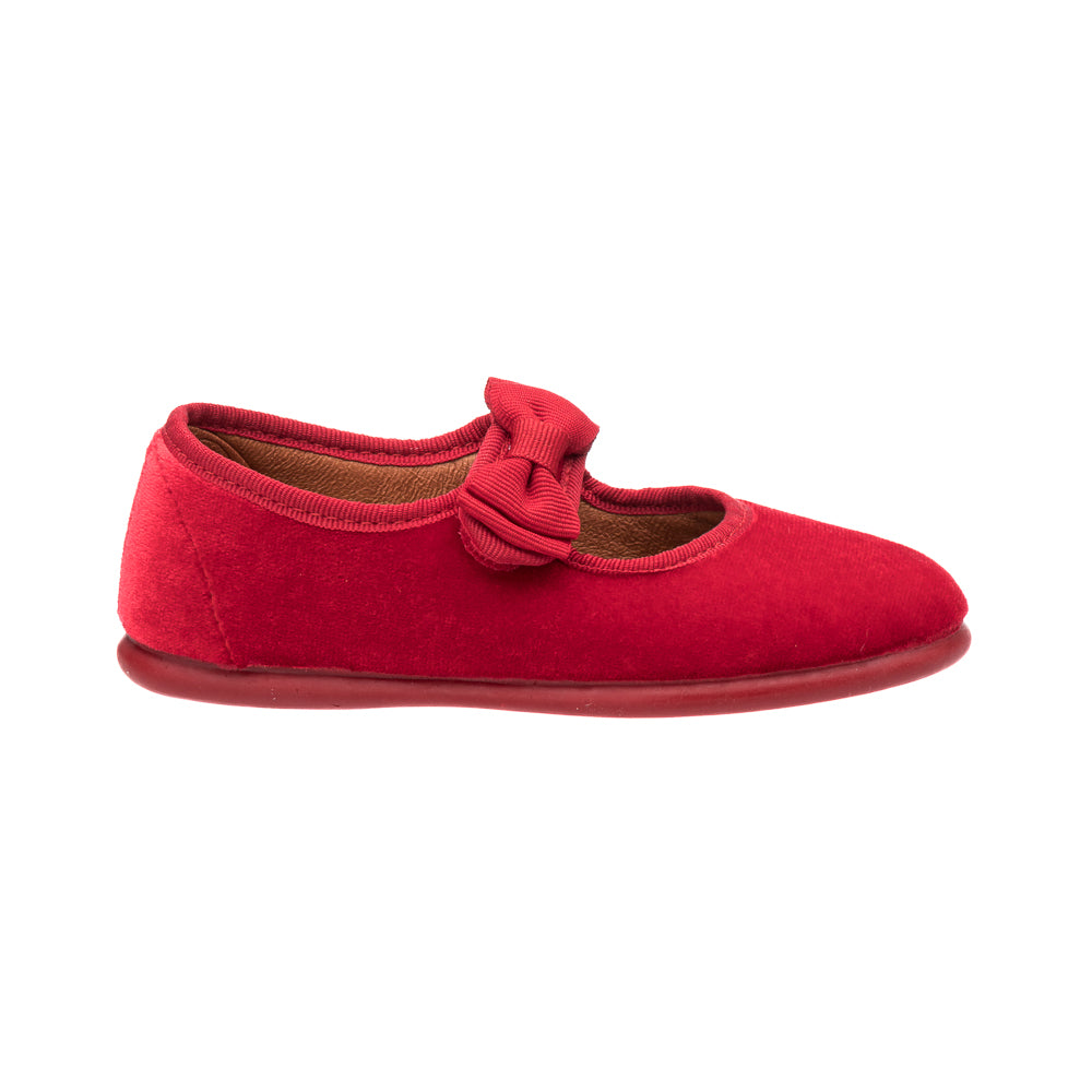 Red velvet Mary Jane shoe with a bow detail and a soft sole for toddlers.