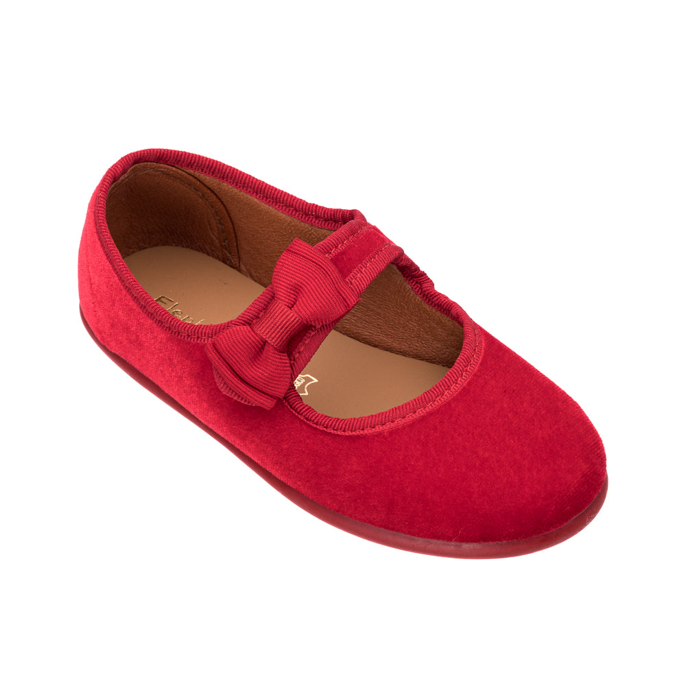 Red velvet Mary Jane shoe with bow detail and rounded toe for toddlers.