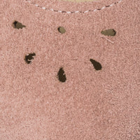 Rose pink suede shoe upper with small teardrop-shaped perforations and scalloped edge detail.