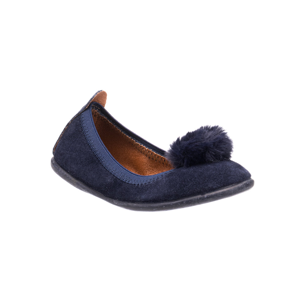Navy blue suede toddler ballerina shoe with a fluffy pom pom on the toe and brown leather inner lining.