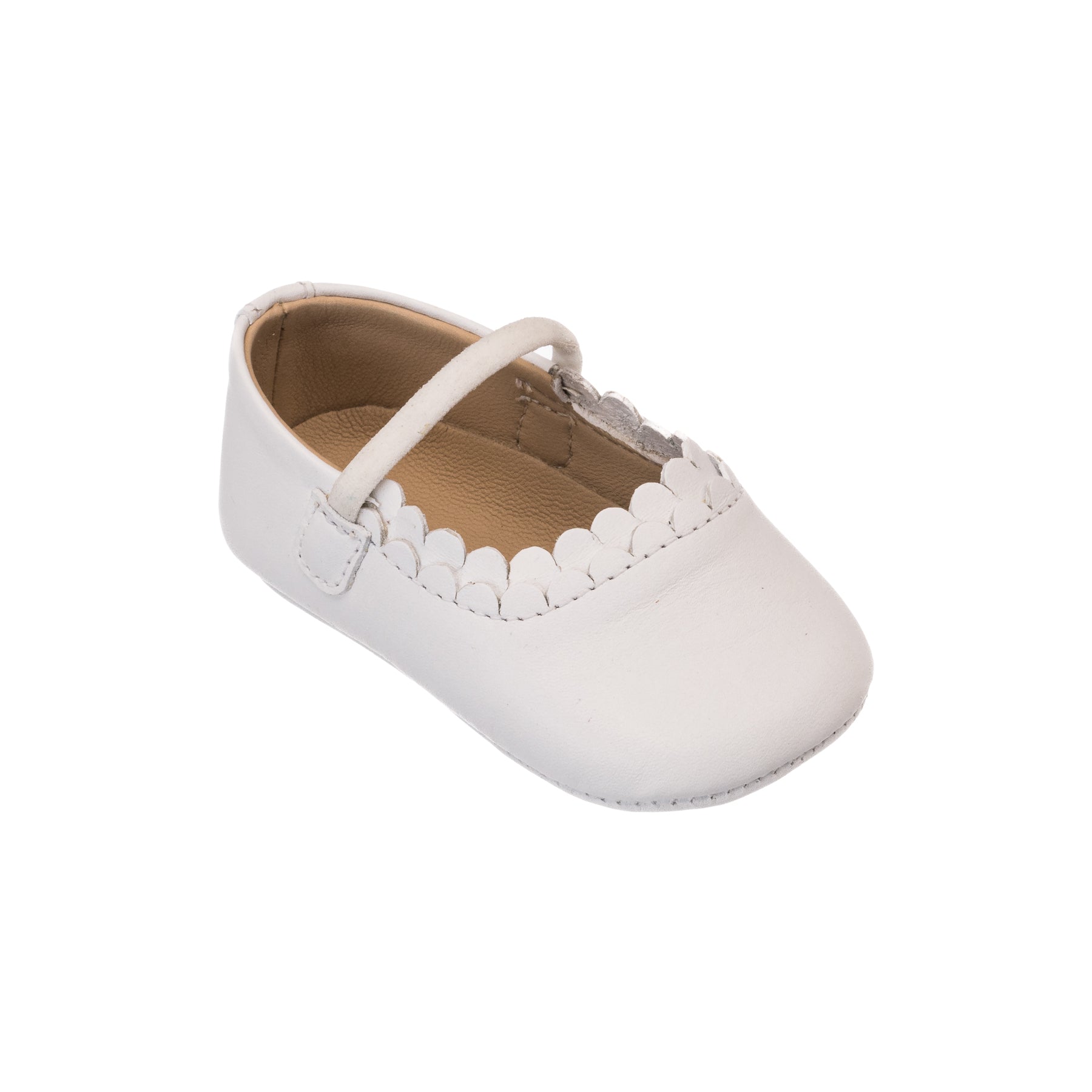 White baby ballet flat with scalloped edge trim and single strap closure.