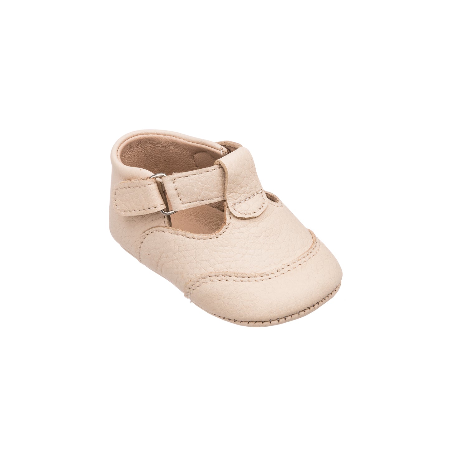 Cream-colored baby T-strap shoe with rounded toe and Velcro strap closure.