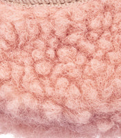 Soft pink shearling detail on baby Mary Jane shoe with textured wool surface.