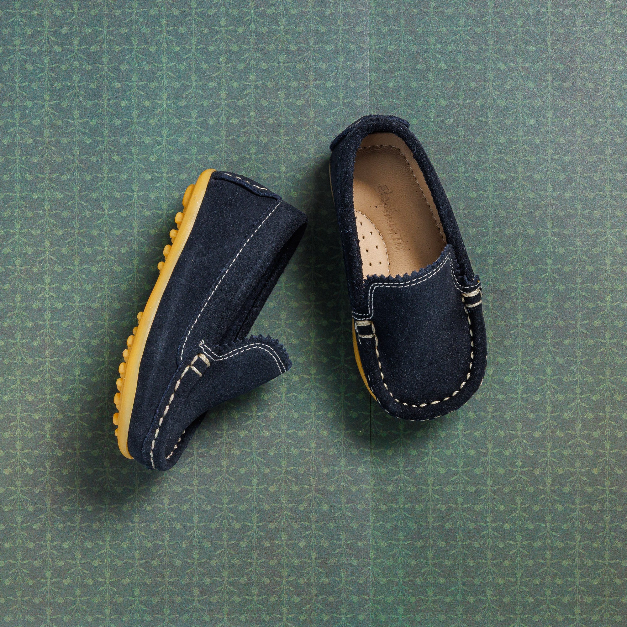 Toddlers' blue suede moccasin-style driver shoes with stitched detailing and rubber soles.