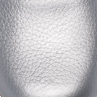 Close-up of silver textured leather toddler flat shoe, smooth rounded toe design.