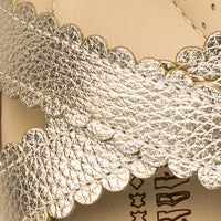 Elephantito - Gold metallic leather sandal strap with scalloped edges and textured finish.