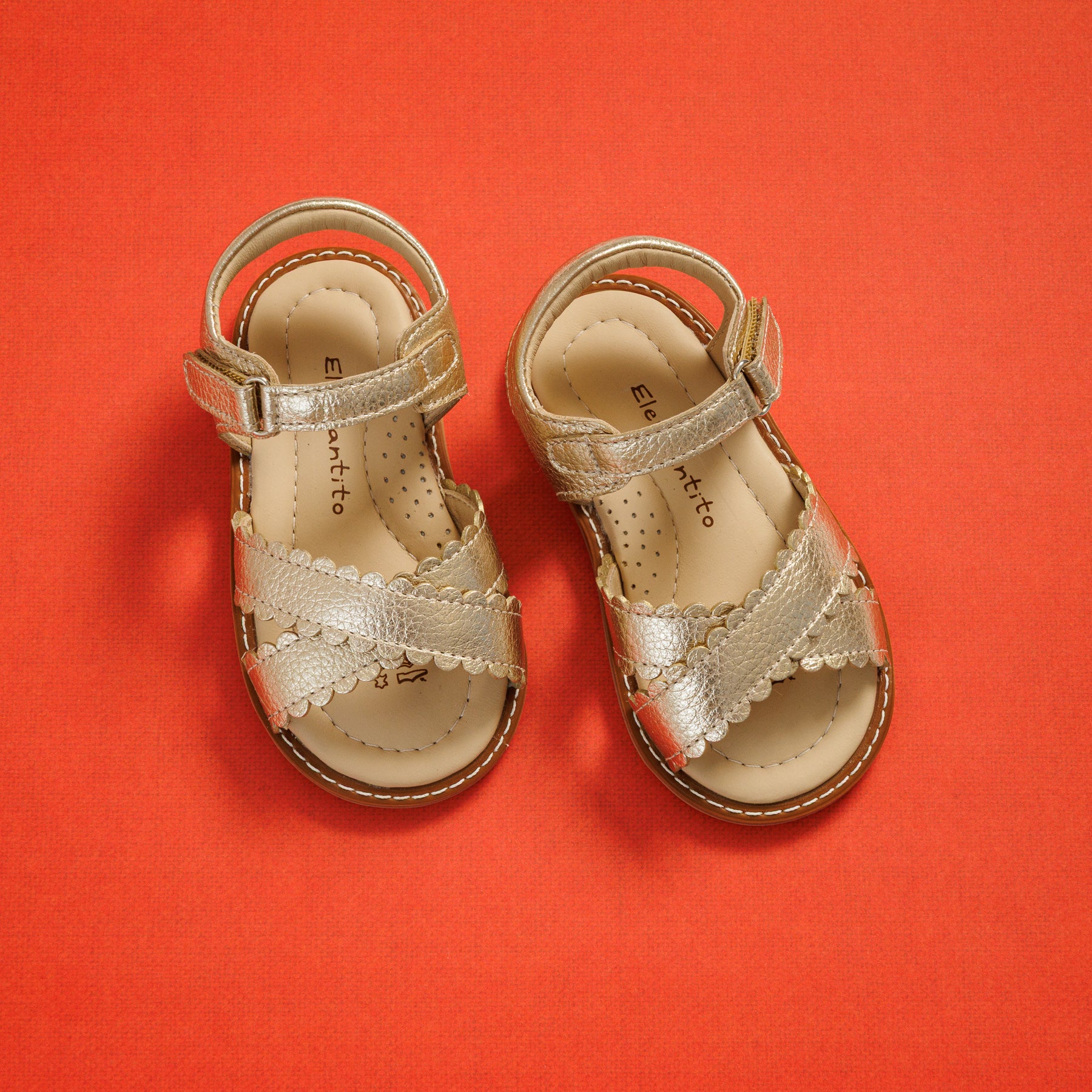 Elephantito - Toddler girls gold metallic sandals with scalloped straps and adjustable ankle closures.