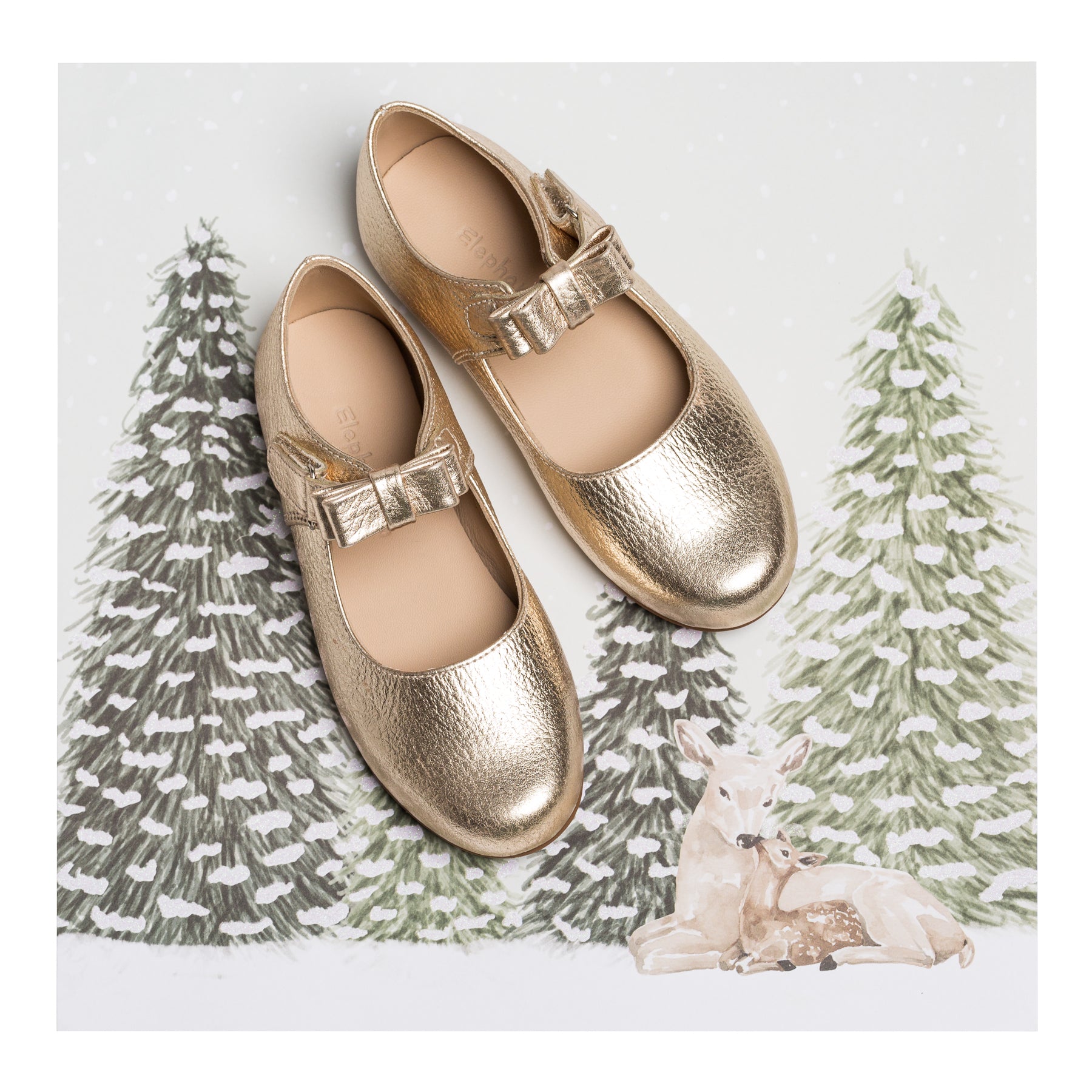 Gold metallic leather Mary Jane shoes with a bow strap for girls, toddler sizes.