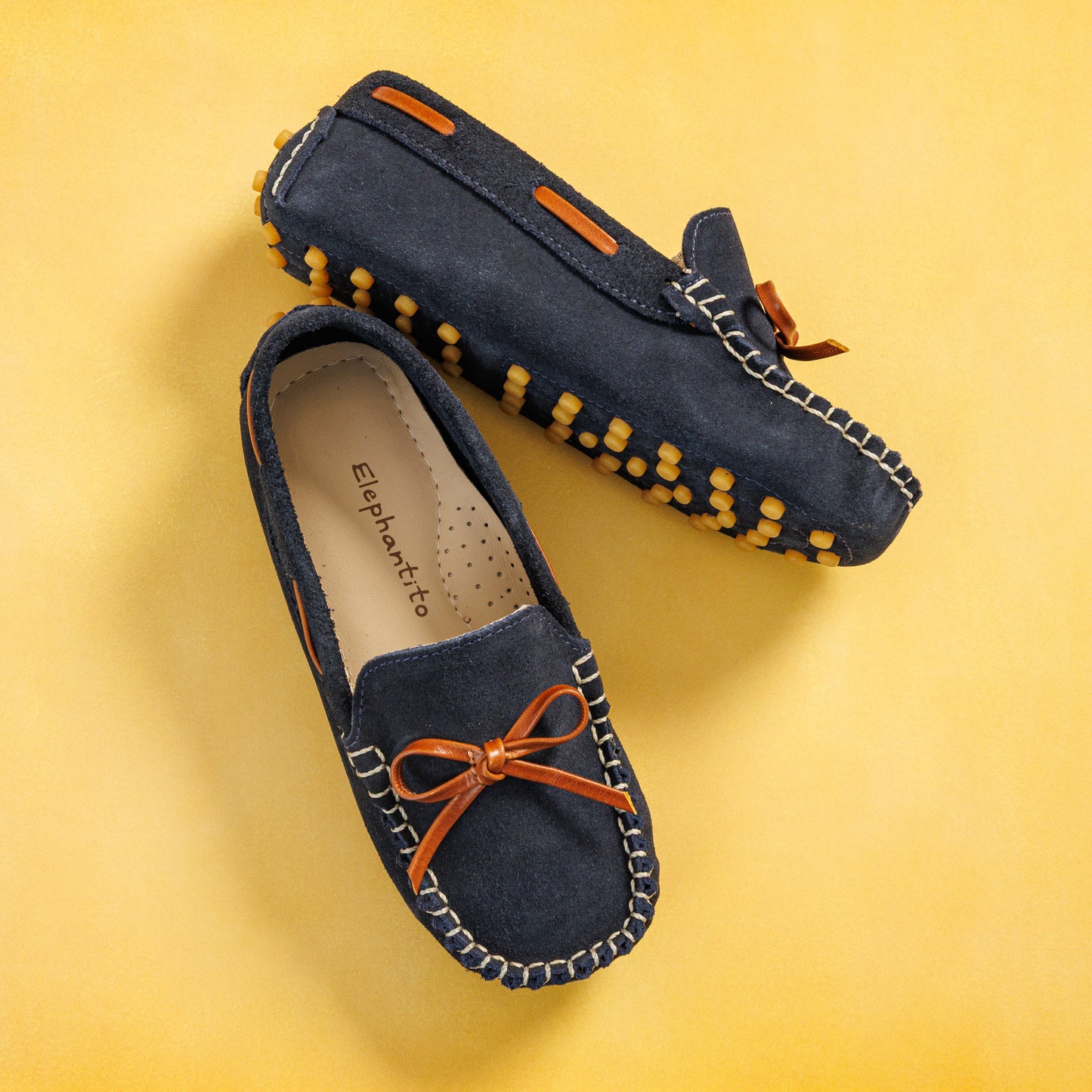 Elephantito - Navy blue suede driver loafers with orange bow and rubber pebble sole for boys.