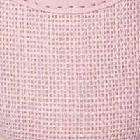 Close-up of pink linen fabric with a woven texture and decorative stitching detail.