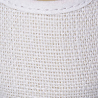 White linen Mary Jane shoe with fine textured fabric and rounded toe.