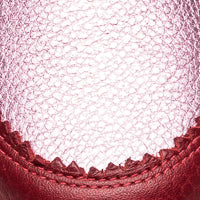 Metallic carnation pink sneaker with textured mesh upper and smooth leather trim stitching detail.