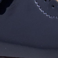 Navy blue patent leather toddler Mary Jane shoe with stitched detailing and rounded toe.