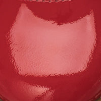 Red patent leather Mary Jane shoe with rounded toe and shiny finish.