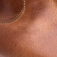 Brown leather children's bootie with visible stitching and smooth texture.