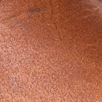 Natural brown smooth leather surface with subtle texture and matte finish.
