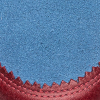 Blue denim sneaker with red zigzag suede trim for children.