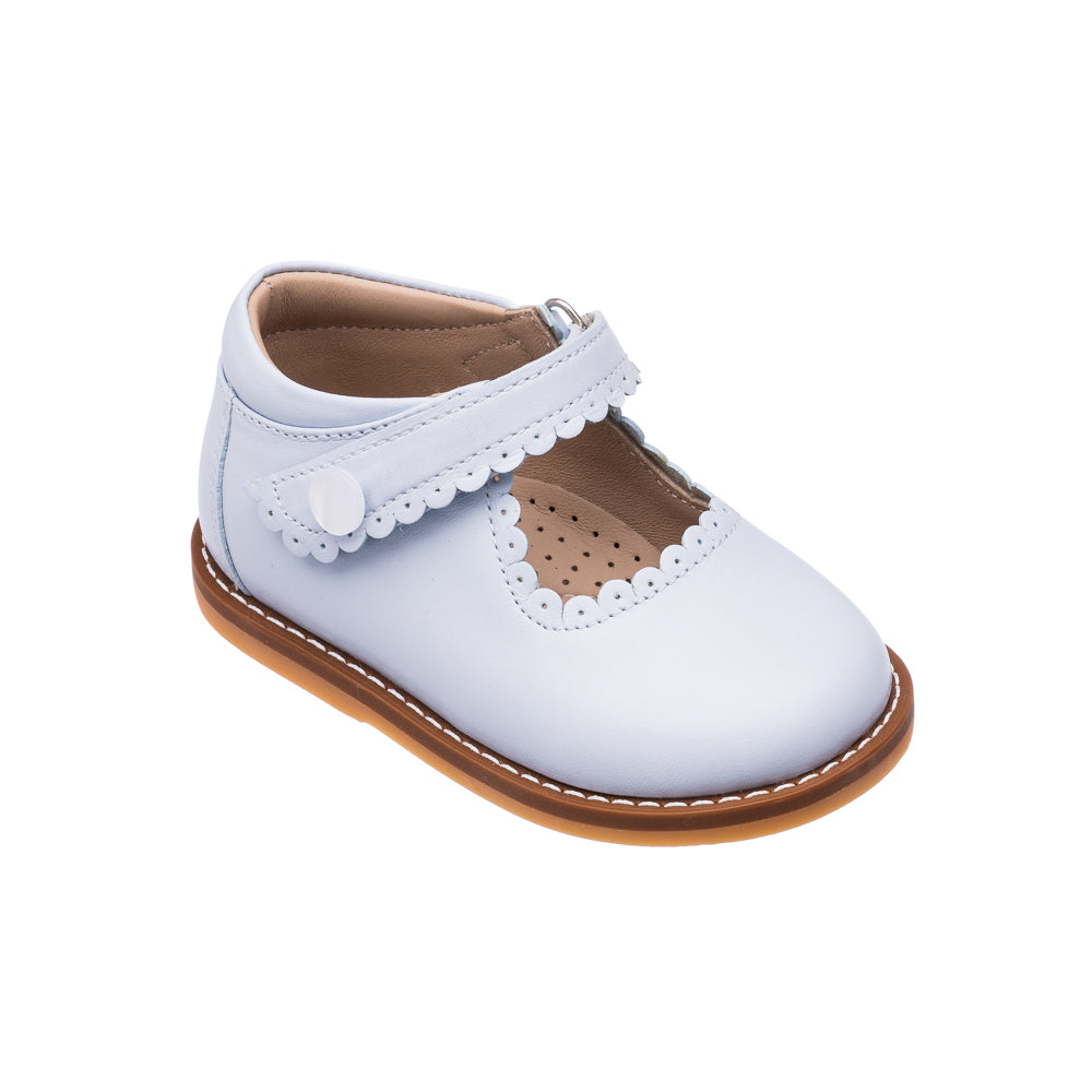 Light blue toddler Mary Jane shoe with scalloped edges, button strap, and brown sole.