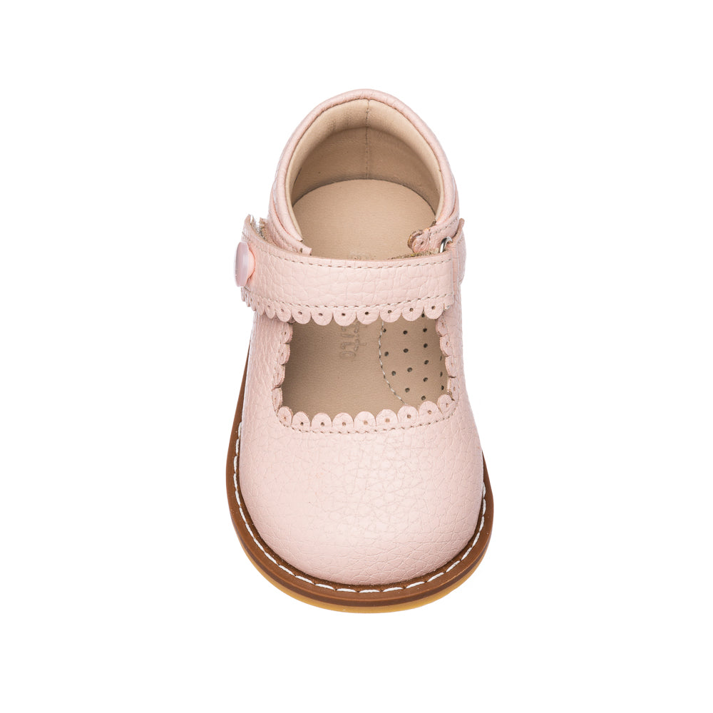 Pink toddler Mary Jane shoe with scalloped edges and velcro strap closure.