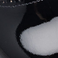 Black patent leather toddler Mary Jane shoe with scalloped edge and round toe.
