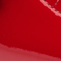 Glossy red patent leather Mary Jane toddler shoe with adjustable strap and smooth finish.