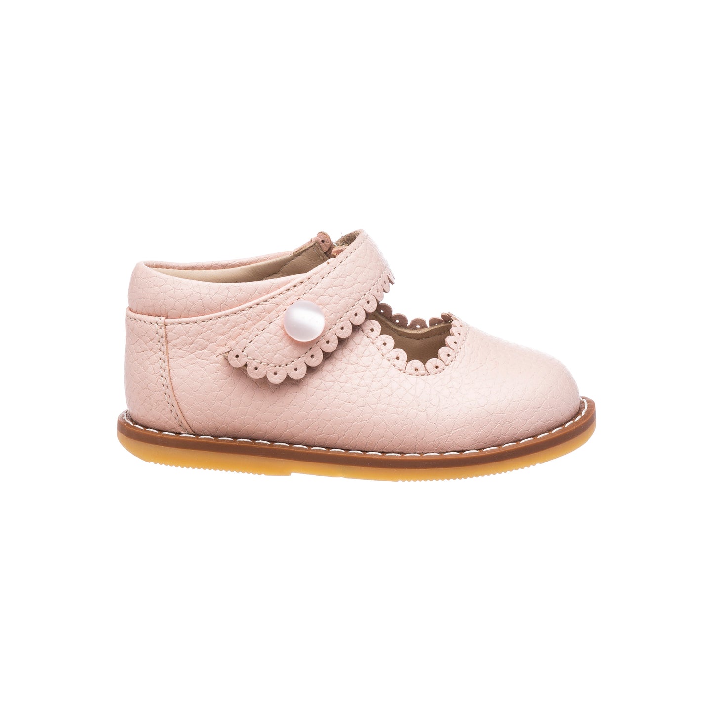 Pink leather toddler Mary Jane shoe with scalloped edges and a button strap closure.