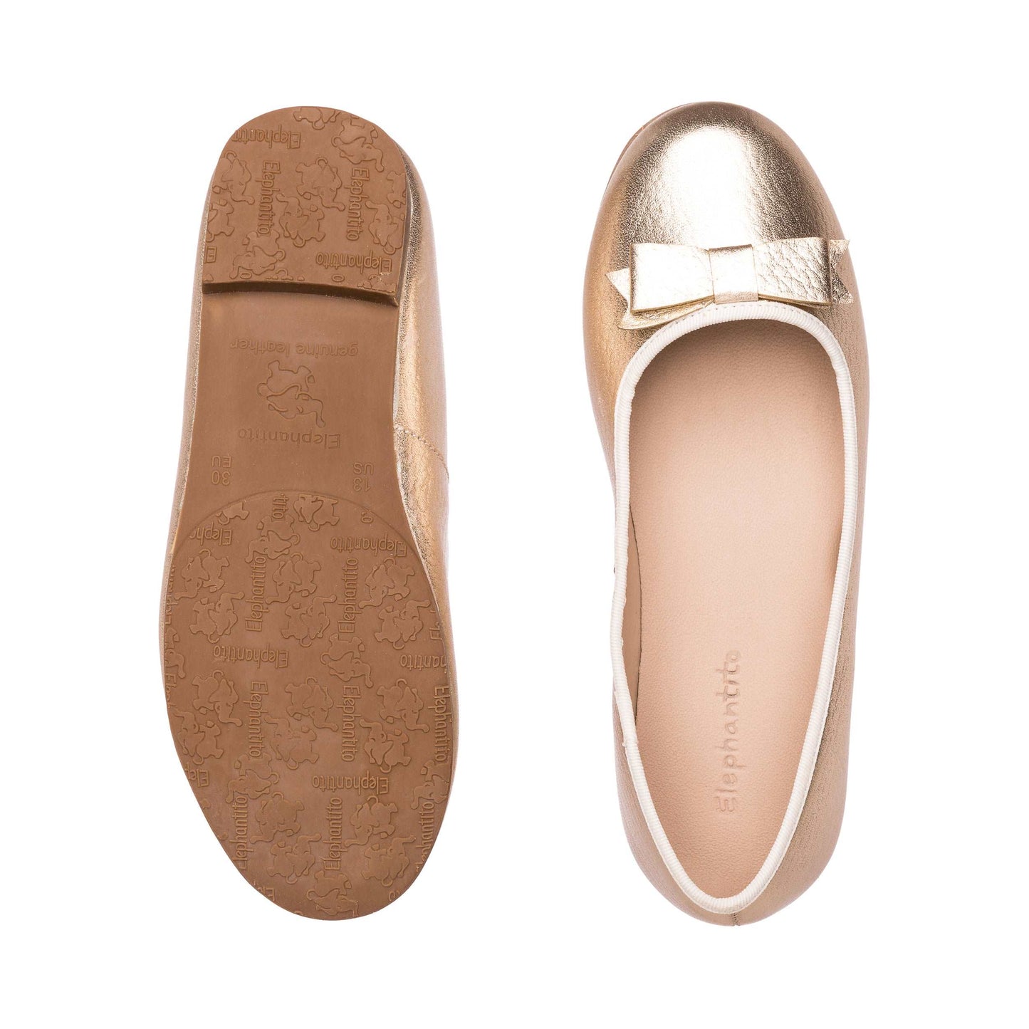 Gold toddler ballet flats with a small bow and textured rubber sole.