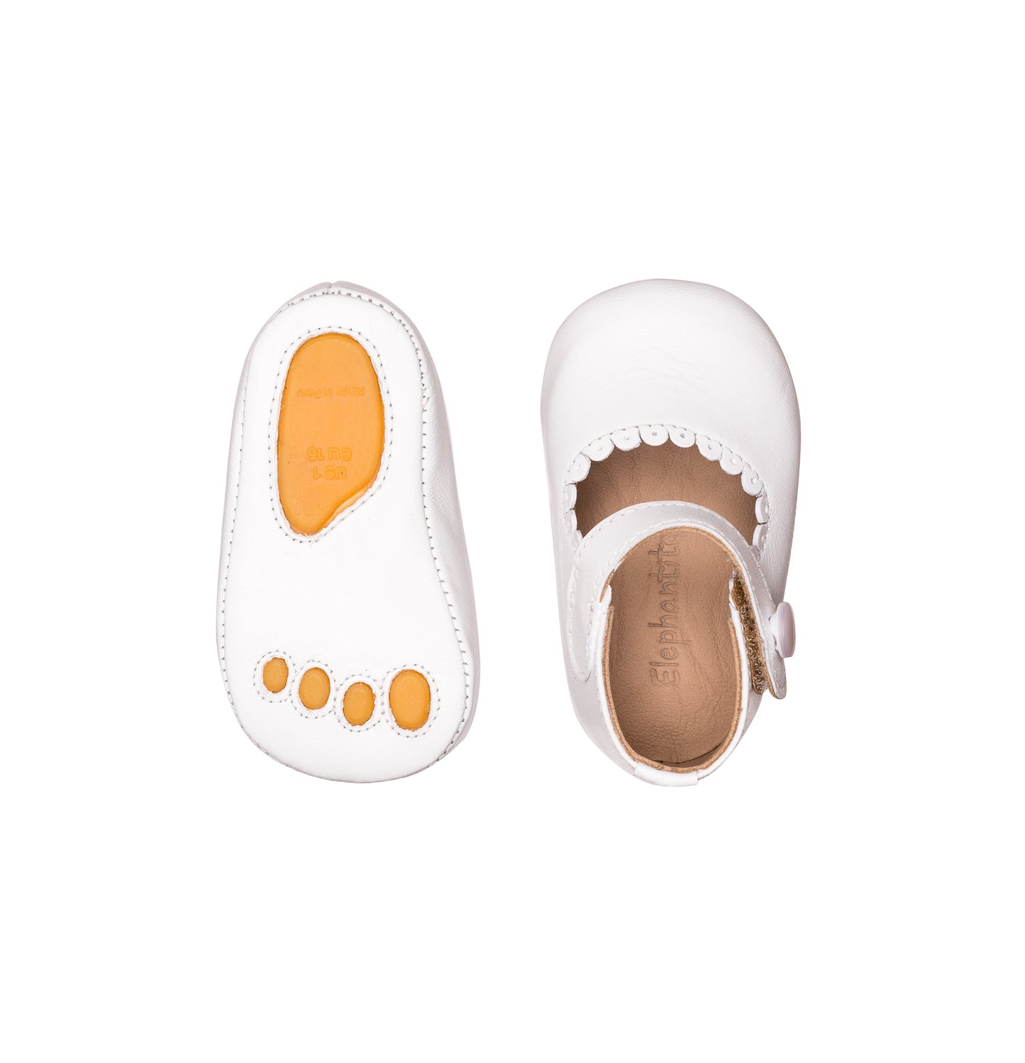 White baby Mary Jane shoe with scalloped edge and ankle strap, showing top and sole views.