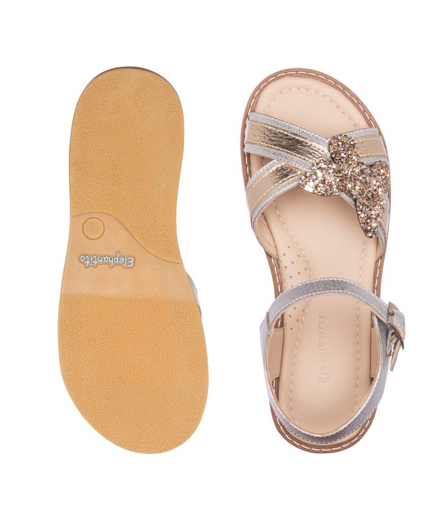 Toddler sandal with glittery butterfly embellishment and crossed silver straps, beige sole.