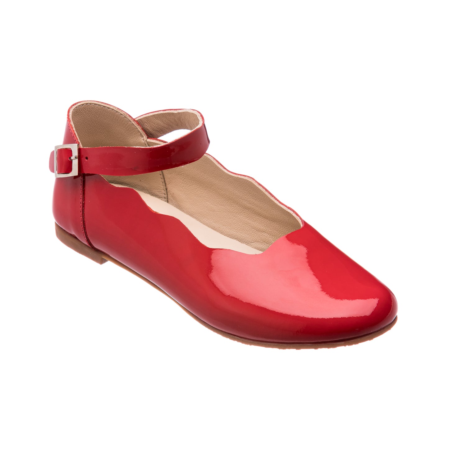 Glossy red patent leather girl’s flat with scalloped edge and ankle strap buckle closure.