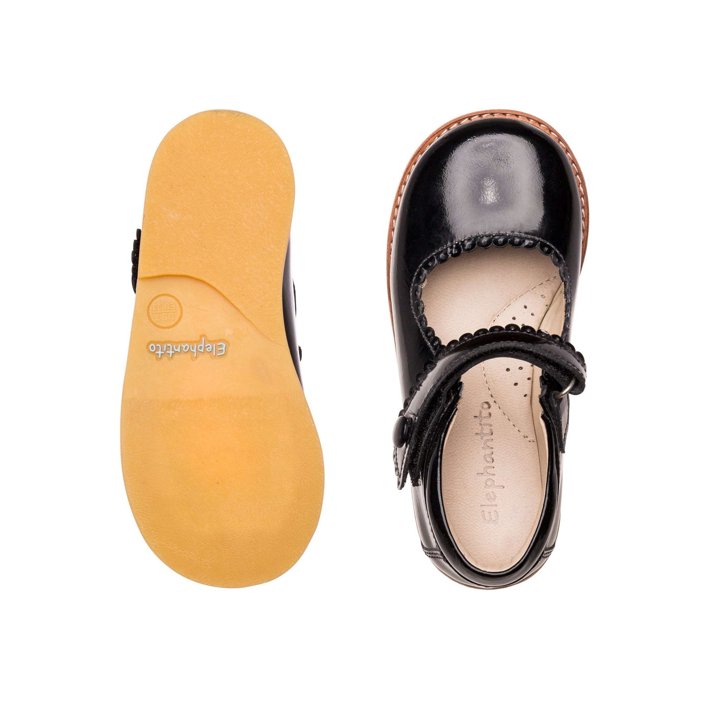 Black patent leather Mary Jane shoe for children with adjustable strap and tan rubber sole.