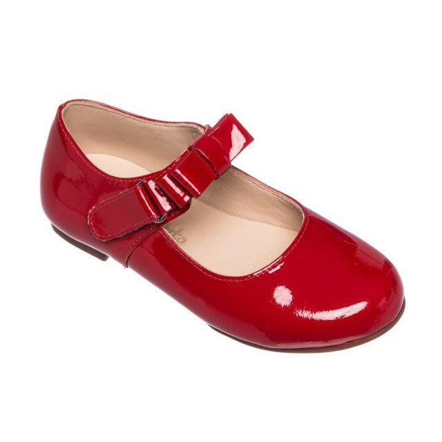 Red patent leather girls Mary Jane shoe with adjustable strap and rounded toe.