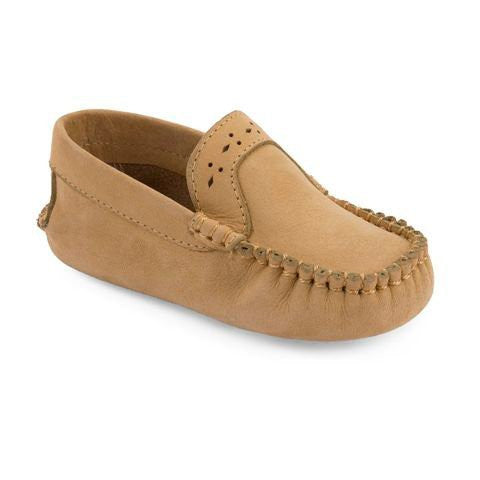 Ivory baby moccasin with stitched detailing and perforated pattern on top.