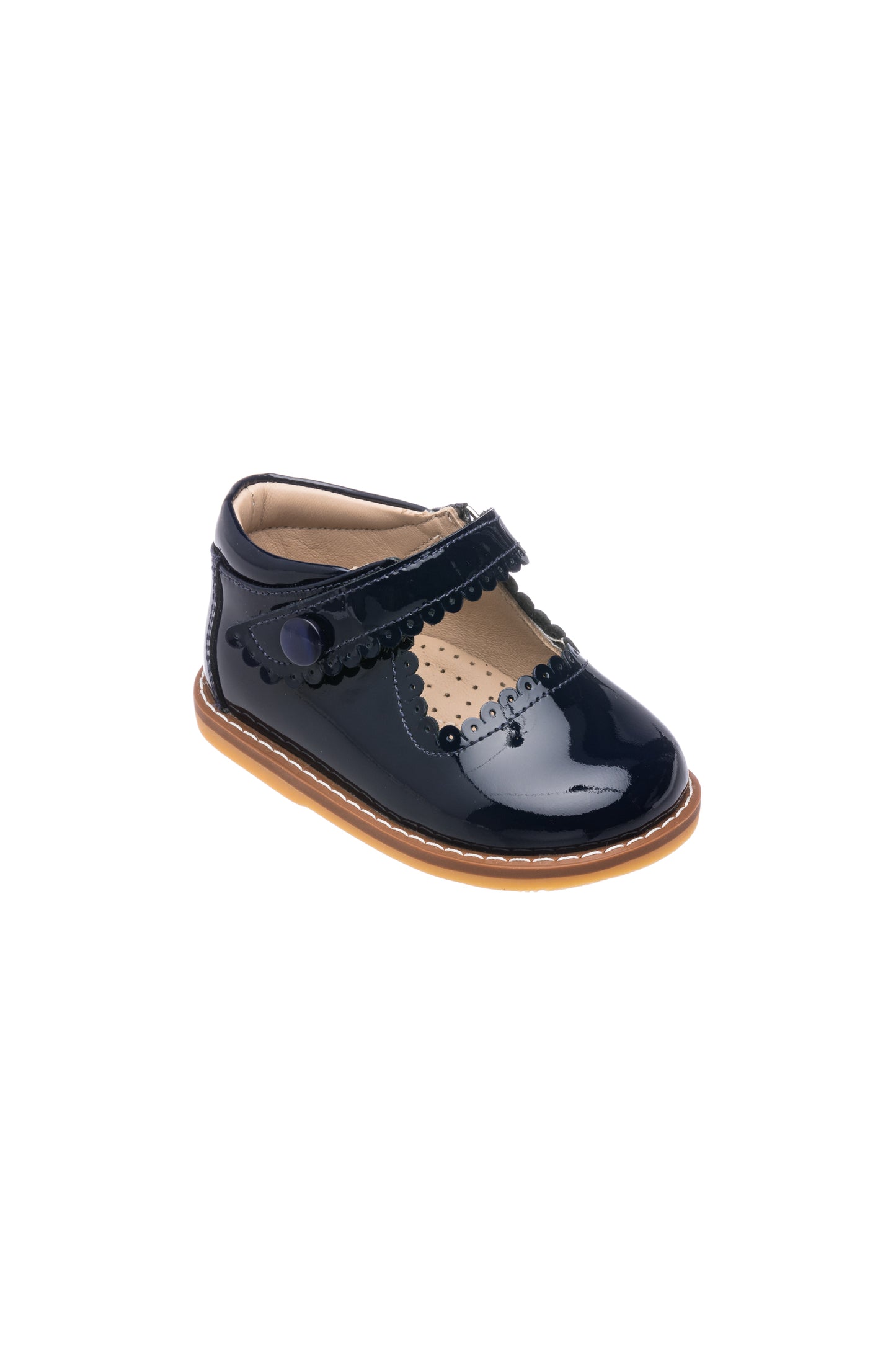 Toddler black patent leather Mary Jane shoe with scalloped edges and tan sole.