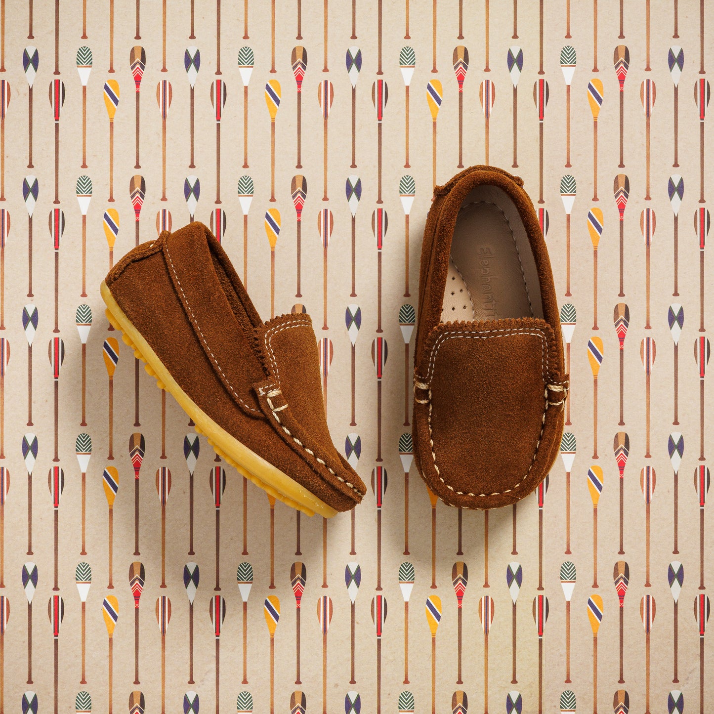Chestnut brown suede toddler moccasin shoes with stitched detailing and rubber sole.