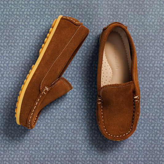 Chestnut suede moccasin-style toddler shoes with stitched detail and rubber sole.