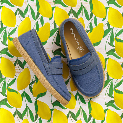 Elephantito - Indigo blue toddler loafer espadrilles with jute-wrapped soles on lemon print fabric background.