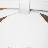 Close-up of white leather sandal upper with smooth texture and neat stitching detail.