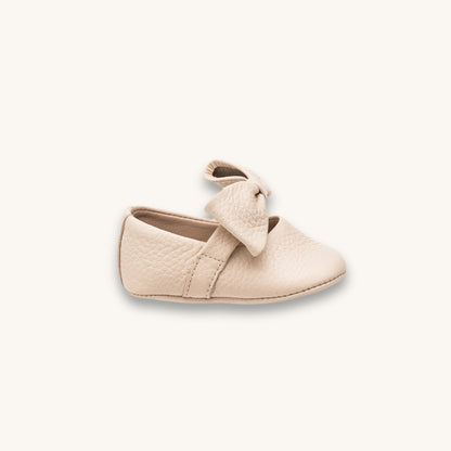 Bébé ballerine avec nœud crème