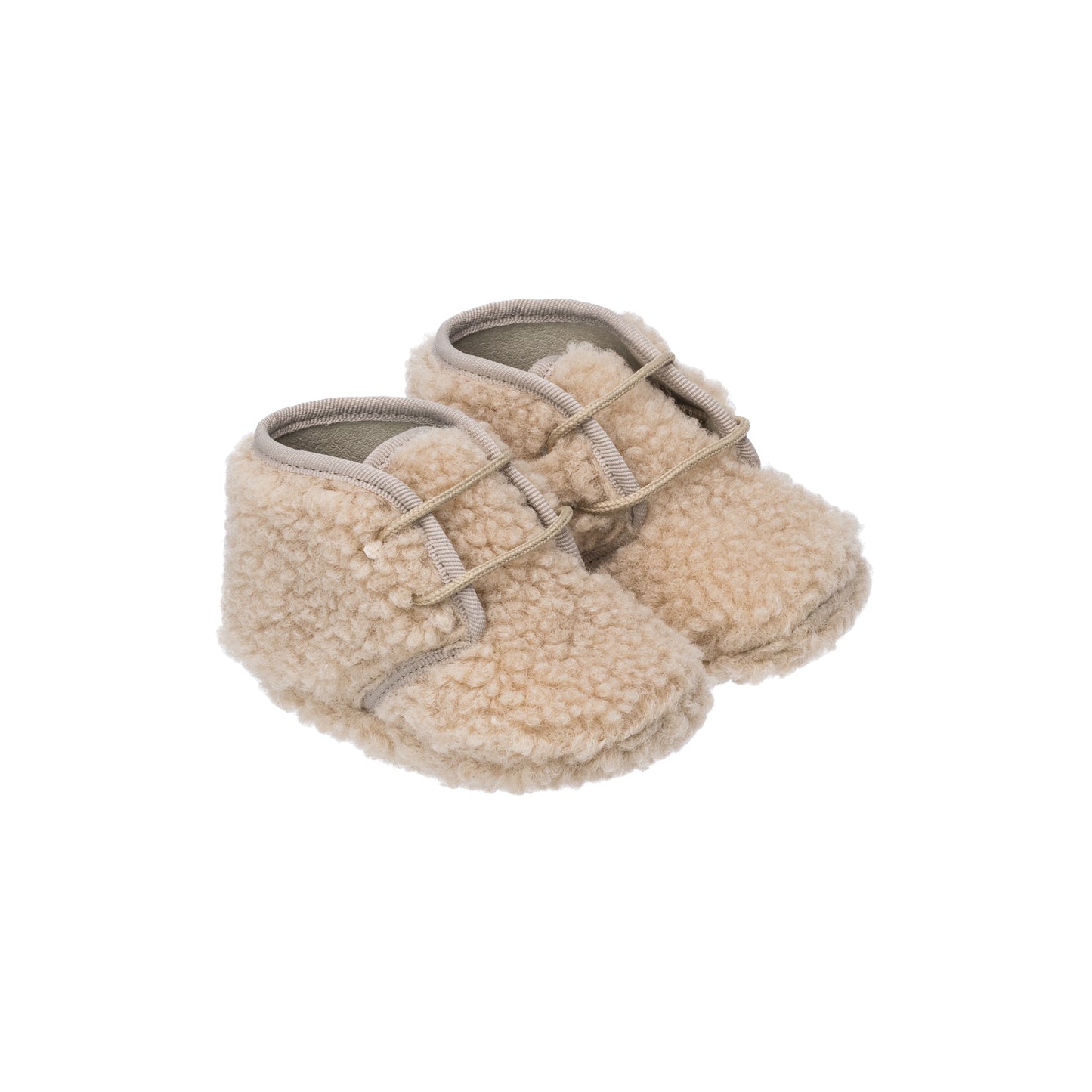 Beige shearling baby booties with soft textured exterior and adjustable strap closure.